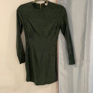 Green velvet long sleeve dress with a gold zipper.